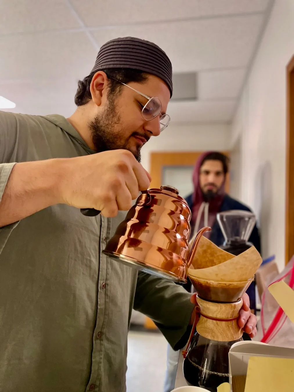 Coffee being poured at a Spilling Beans gathering