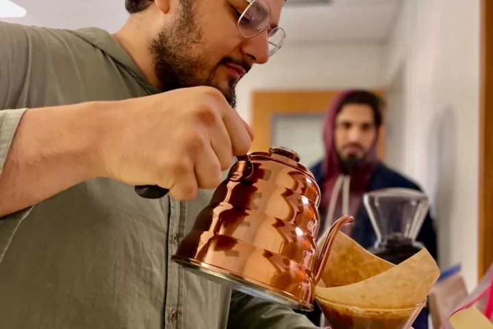 Coffee being poured at a Spilling Beans gathering